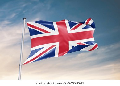 Waving flag of United Kingdom in beautiful sky. United Kingdom flag for independence day. The symbol of the state on wavy fabric.