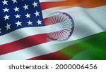 The waving flag of the United States of America and India Intersecting with each other.