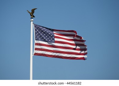Waving flag of the usa with golden eagle