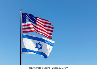 Waving Flags Of USA And Israel On The Same Flagpole On Background Of Blue Sky. Copy Space For Text. Design, Template Horizontal Plane High quality photo - Powered by Shutterstock