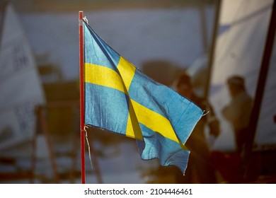 Waving Swedish Flag On Ice Sailing