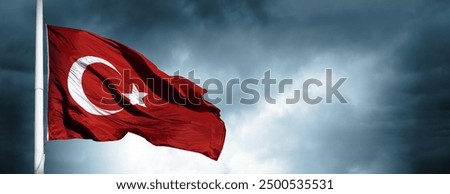 The waving Turkish flag and dark cloud