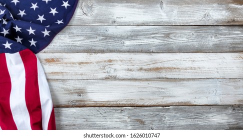 Waving United States Flag on left side of white rustic wooden Background   - Powered by Shutterstock