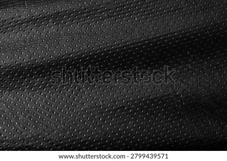 Wavy Black Dimpled Plastic Material Texture Background