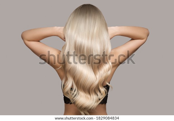 wavy blond hair back\
view