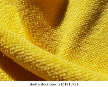 Wavy Bright Yellow Micro Fibre In Counte Arcuate Folds (macro, Texture).