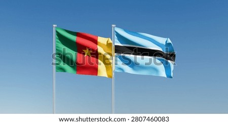 Wavy Cameroon and Botswana Flags and Clear Blue Sky
