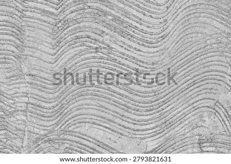 Wavy concrete texture with grooved pattern, abstract grey cement wall background