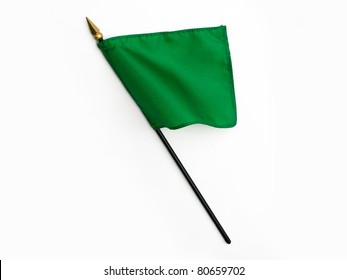 Wavy Green Silk Flag On Pole Isolated On White Background