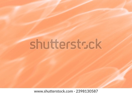 Wavy lines of light as Abstract background peach colored, natural flare from lights, trend color year 2024 peach fuzz monochrome photo with optical effect, blur texture as holiday backdrop, wallpaper