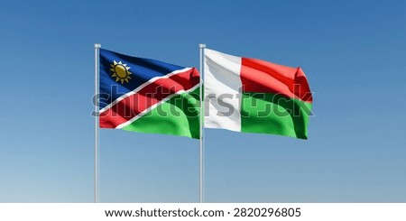 Wavy Namibia and Madagascar Flags and Clear Blue Sky