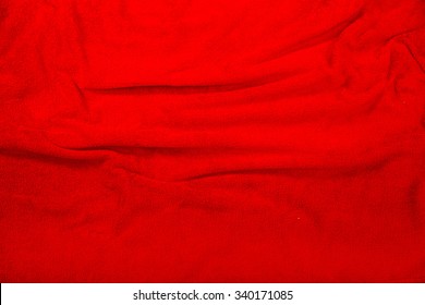 A Wavy Red Blanket Background.