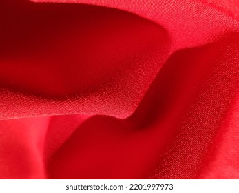 Wavy Red Fabric In The Sun, In Folds (macro, Texture).