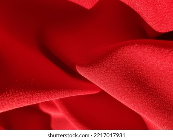 Wavy Red Fabric In The Sun, In Folds (macro, Texture).