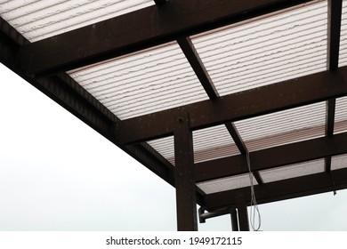 Wavy roofing material made of polycarbonate. Weatherproof material used for carports and balcony roofs.