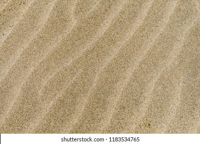 Wavy sand texture on Pacific Northwest beach.