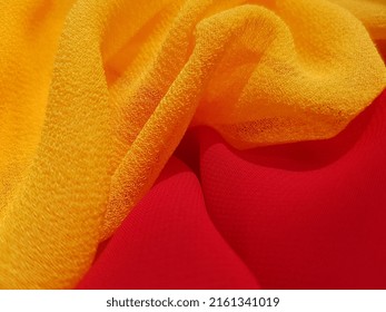 Wavy Yellow And Red Two Translucent Fabrics - In The Sun, In Folds (macro, Top View, Texture).