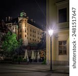 Wawel Castle at night, Krakow, Poland View from Grodzka street with visible old tenement house.