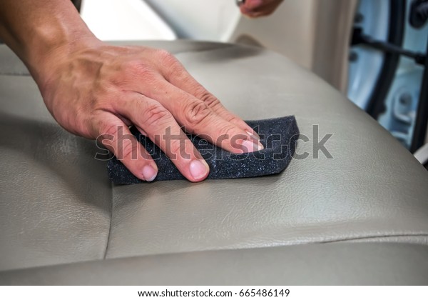 waxing car interior by\
sponge.