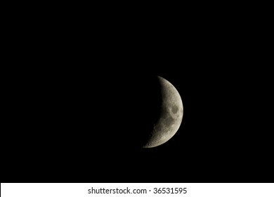 Waxing crescent moon closeup isolated against a black night sky