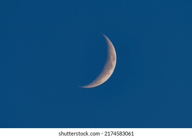 Waxing crescent moon in the evening sky.