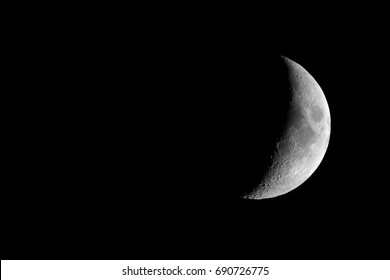 Waxing crescent moon seen with an astronomical telescope, 3:2 format in black and white (taken with my own telescope, no NASA images used)