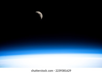 A waxing crescent Moon as seen from the international space station. Digitally enhanced. Elements of this image furnished by NASA.   - Powered by Shutterstock