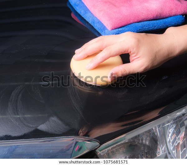 waxing process,polishing the\
car