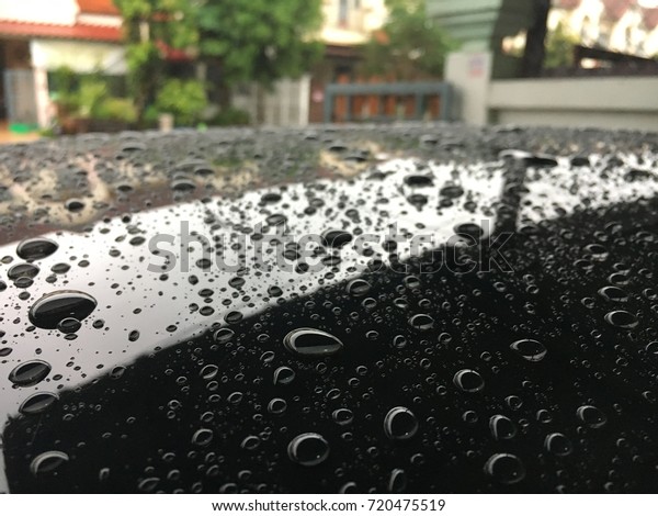 Waxing spa roof cars with\
rain water