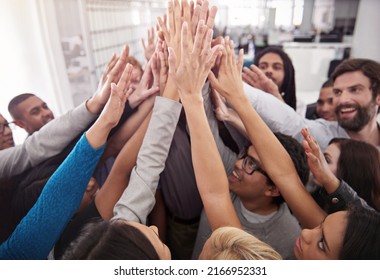 Way To Go, Team. Shot Of A Business Team Raising Their Hands While Standing In A Huddle.