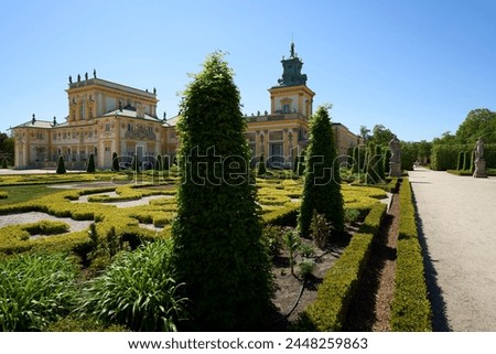 Way to palace at Wilanow in European Warsaw capital city of Poland in Masovian, clear blue sky in 2022 warm sunny spring day on May.