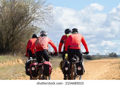 Way of St James , Camino de Santiago , pilgrims cycling  to Compostela near Astorga , Leon, Spain