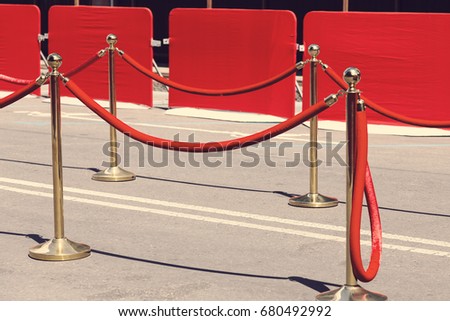 Way to success on the red carpet (Barrier rope). Toning. Selective focus