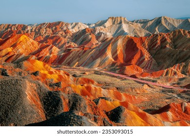 The way through the rainbow Colorful rock formations in the Zhangye Danxia Landform Geological Park. Rainbow mountain in China. Blue sky with copy space - Powered by Shutterstock