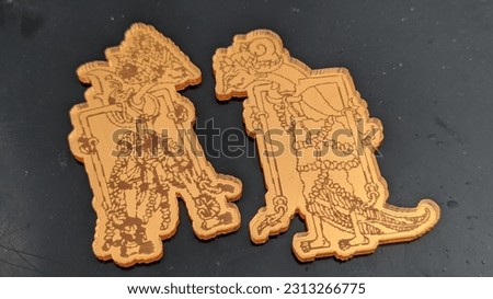 wayang motif engraving on gold glass acrylic. very unique and artistic value