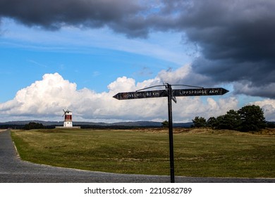 wayside cross with mill and clouds