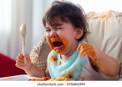 Wayward Little Toddler Child Or Infant Baby Crying That Don't Want Eating Food On Baby Chair Cute Infant Children Get Hungry And Want New Food Children Get Dirty Kid Get Tantrum Baby Is Stubborn Baby