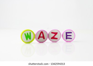 Waze word background made up from alphabet printed round shape eraser