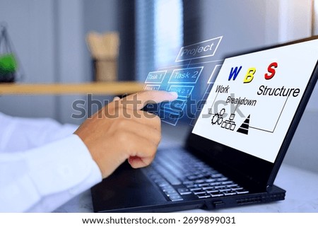 WBS work breakdown structure concept with hand pointing to works on laptop screen to analyze project task to break down work details on virtual interface
