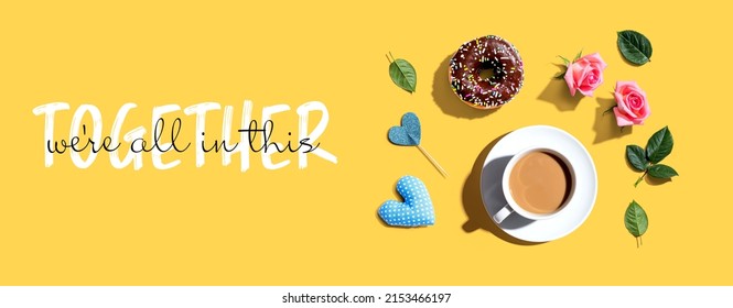 We Are All In This Together Message With A Cup Of Coffee And A Donut - Flat Lay