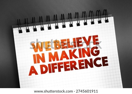 We Believe in Making a Difference text on notepad, concept background
