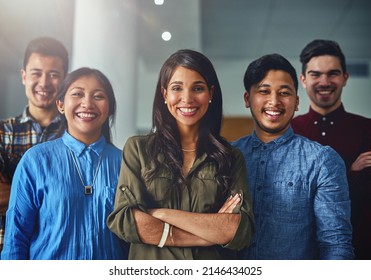 We Boast A Track Record Of Multiple Successes. Portrait Of A Team Of Confident Young Designers Standing Together In An Office.