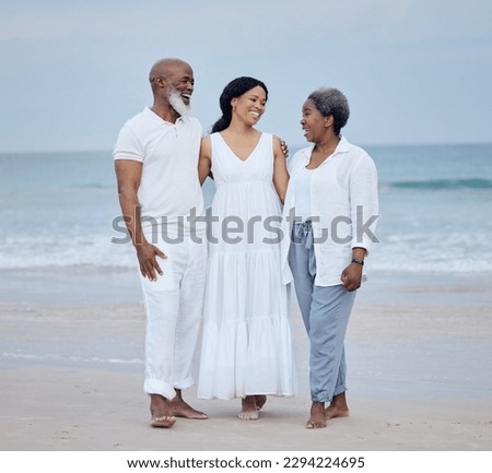 We build, we dont fantasise. Shot of a mature couple enjoying time with their daughter at the beach.