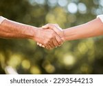We can do this together. Shot of two unrecognisable men shaking hands outdoors.