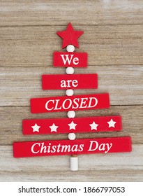 We Are Closed Christmas Day Message With A Wood Christmas Tree On Grunge Wood Sign