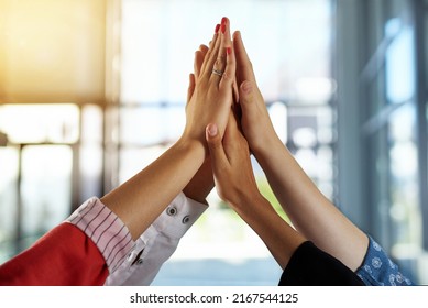 We Did It. Shot Of A Group Of People Putting Their Hands Up Together.