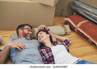 We Did It My Love. Shot Of A Happy Couple Relaxing Together In Their Home On Moving Day.