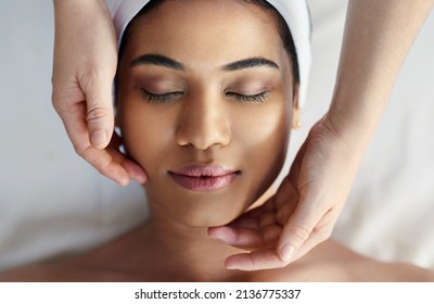 We Give All Our Clients The Special Treatment. Shot Of A Young Woman Getting A Facial Treatment At A Spa.