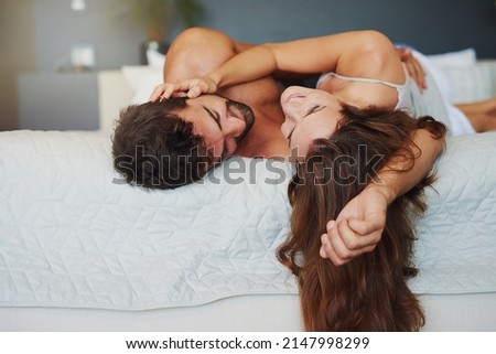 Similar – Man looking to beautiful woman lying on bed