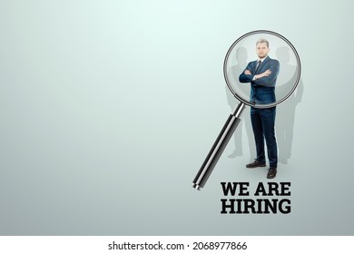 We are hiring, creative background flyer template. Recruiting new employees, we are looking for new candidates for our team, we have posted a vacancy. Examine the employee through a magnifying glass - Powered by Shutterstock